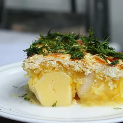 Картофель с кабачком под сырным соусом