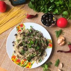 Capellini con funghi e olive