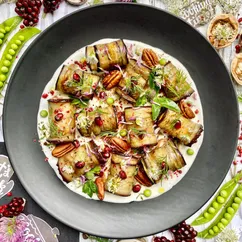 Eggplant rolls, sour cream and pomegranate sauce