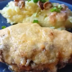 Свинина с грибами под сыром в духовке