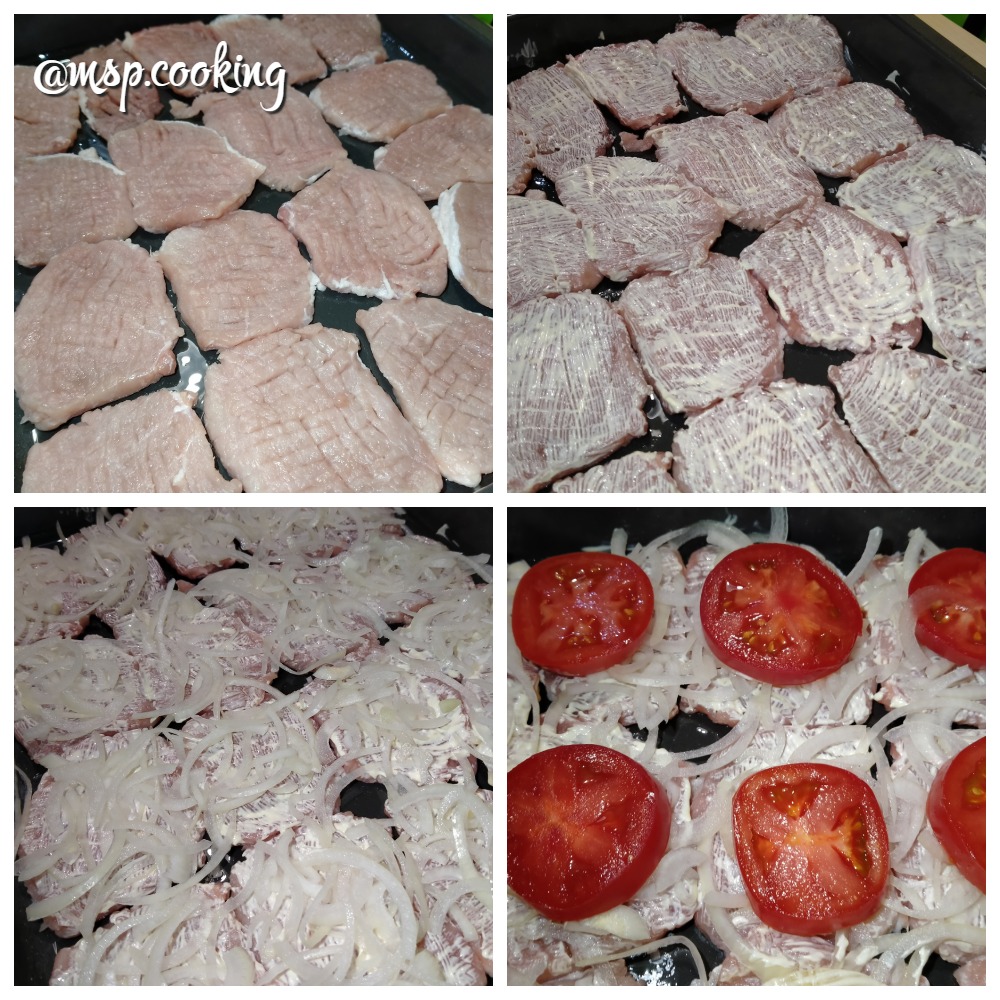 Свиные отбивные под сыром с луком и помидором в духовке